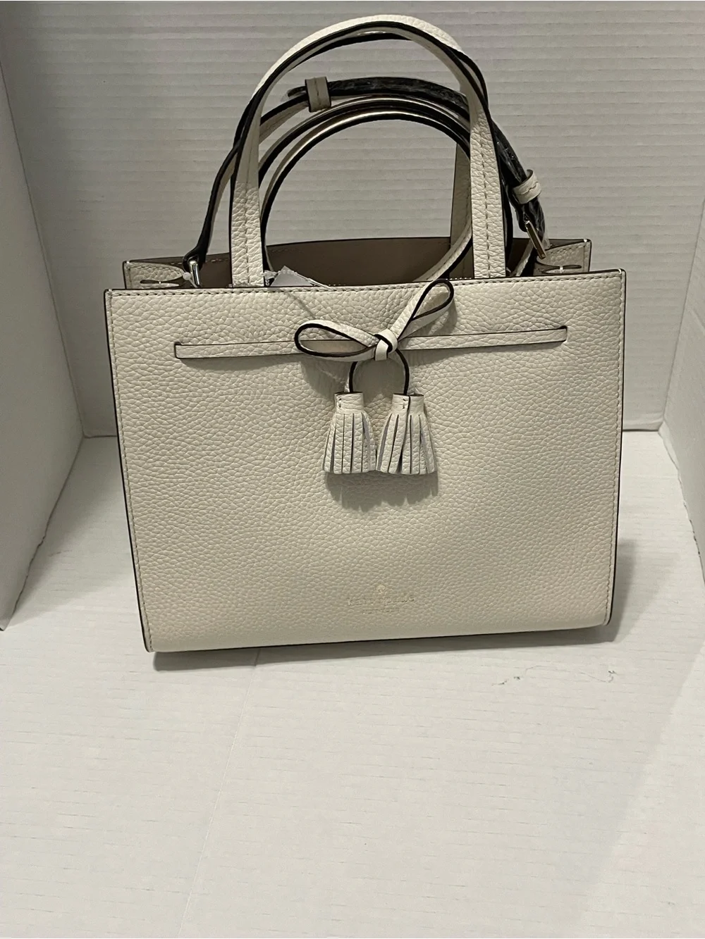 kate spade Cream Pebbled Leather Satchel with Tassel Accent